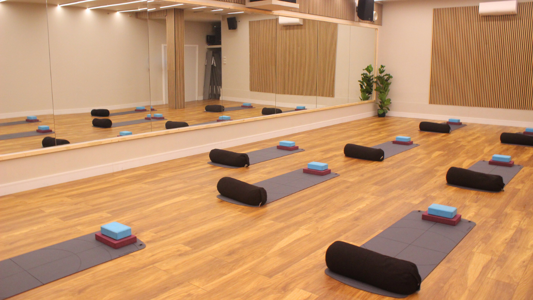 arranged yoga mats ready for a class at RINTO Fitness studio in Richmond, London, creating a calm and welcoming atmosphere for participants.